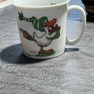Suzy’s Zoo. Festive Duck Mug with Green and Red Accents